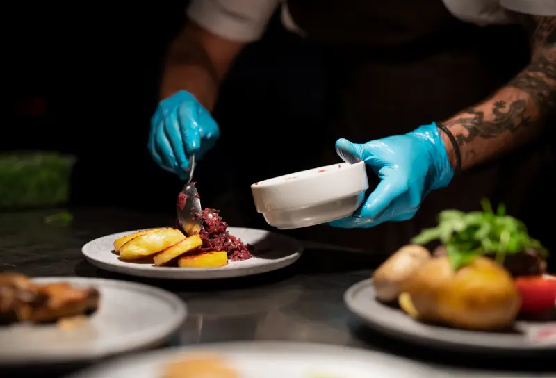 chef-39-s-hands-in-gloves-serving-and-decorating-2024-10-21-05-46-06-utc