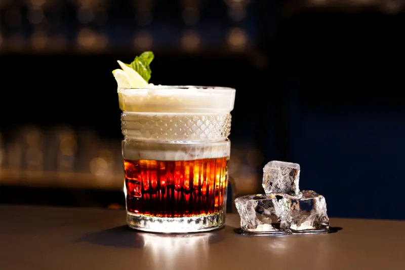 on-a-bar-counter-and-a-dark-background-alcoholic-2024-12-05-11-35-49-utc