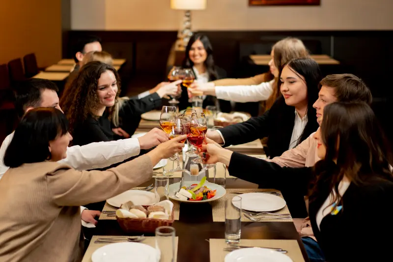 work-colleagues-in-a-restaurant-celebrating-the-co-2024-12-04-19-08-18-utc